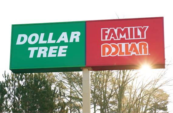 This photo shows an image of a store sign with the Dollar Tree logo and the Family Dollar logo side-by-side.